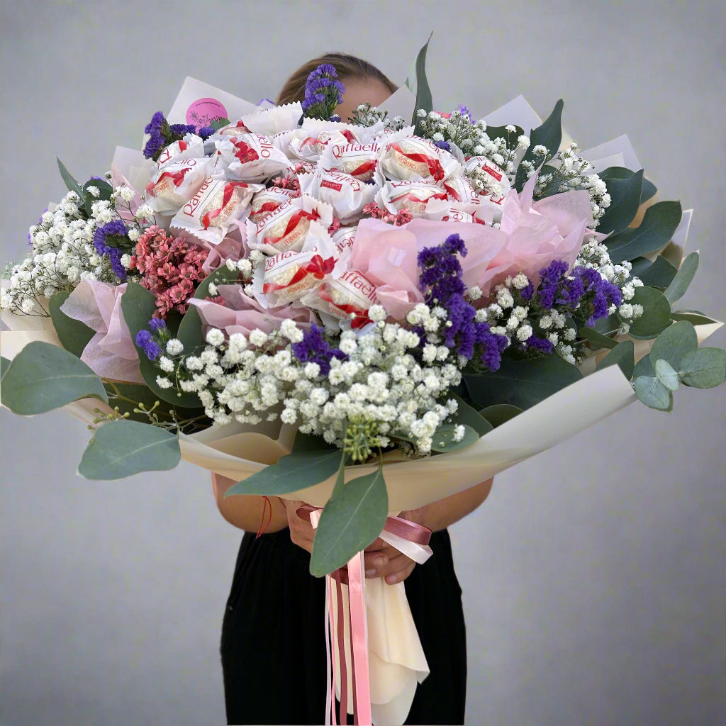 "Raffaello Candy Flower Bouquet," "luxurious flower bouquet," "flower bouquet with chocolates." "unique gift ideas," "flower and candy bouquet," "Raffaello bouquet."