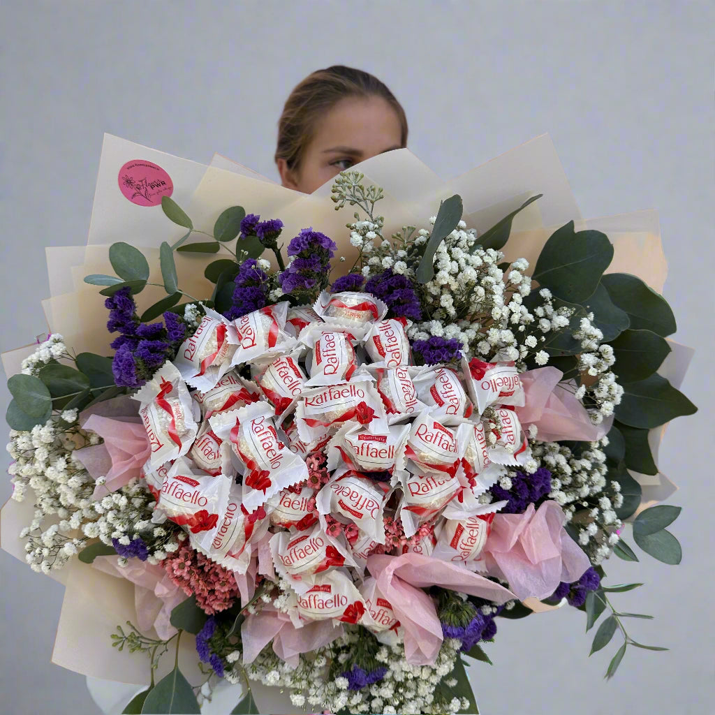 "Raffaello Candy Flower Bouquet," "luxurious flower bouquet," "flower bouquet with chocolates." "unique gift ideas," "flower and candy bouquet," "Raffaello bouquet."